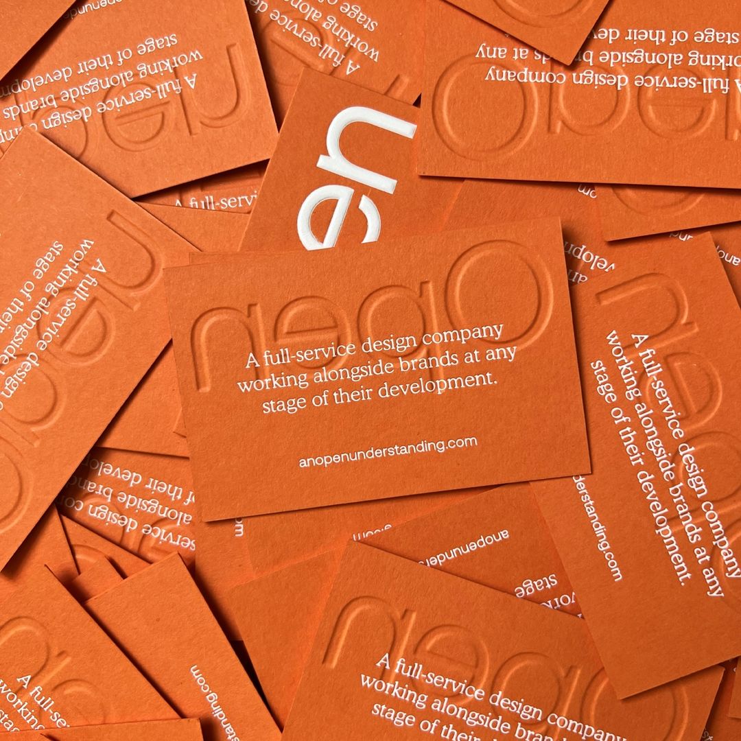 Foil embossed <a href="/colorplanpapers/">GF Smith Colorplan</a> Mandarin 540gsm for <a href="/open_under/">An Open Understanding</a>'s business cards, printed by <a href="/JotPaperCo/">Jot Press</a>.