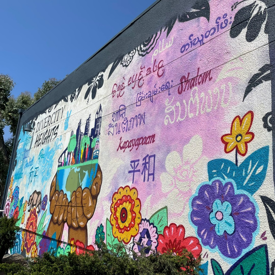 FeedingSanDiego's tweet photo. This #aapiheritage month, we are celebrating the work of our partner, @UPAC_SD, whose mission is to improve the well-being and education of Asian, Pacific Islander, and other communities. They recently unveiled a new mural, "Divercity Heights," which our staff was able to attend! https://t.co/QToUTHTDvR