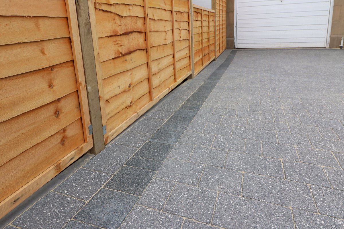 Full driveway monoblocked in Edinburgh. Argent dark and graphite with a brick slot drain channel.