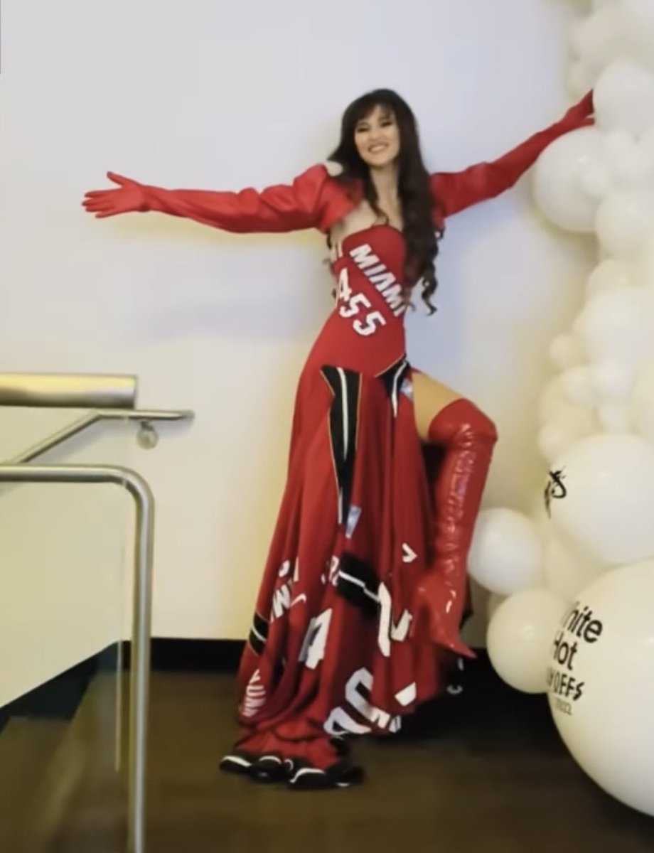 Since so many people were asking about the Heat fan in the amazing outfit  court side last night, opera singer Radmila Lolly, here's a link to her  National Anthem performance in Miami