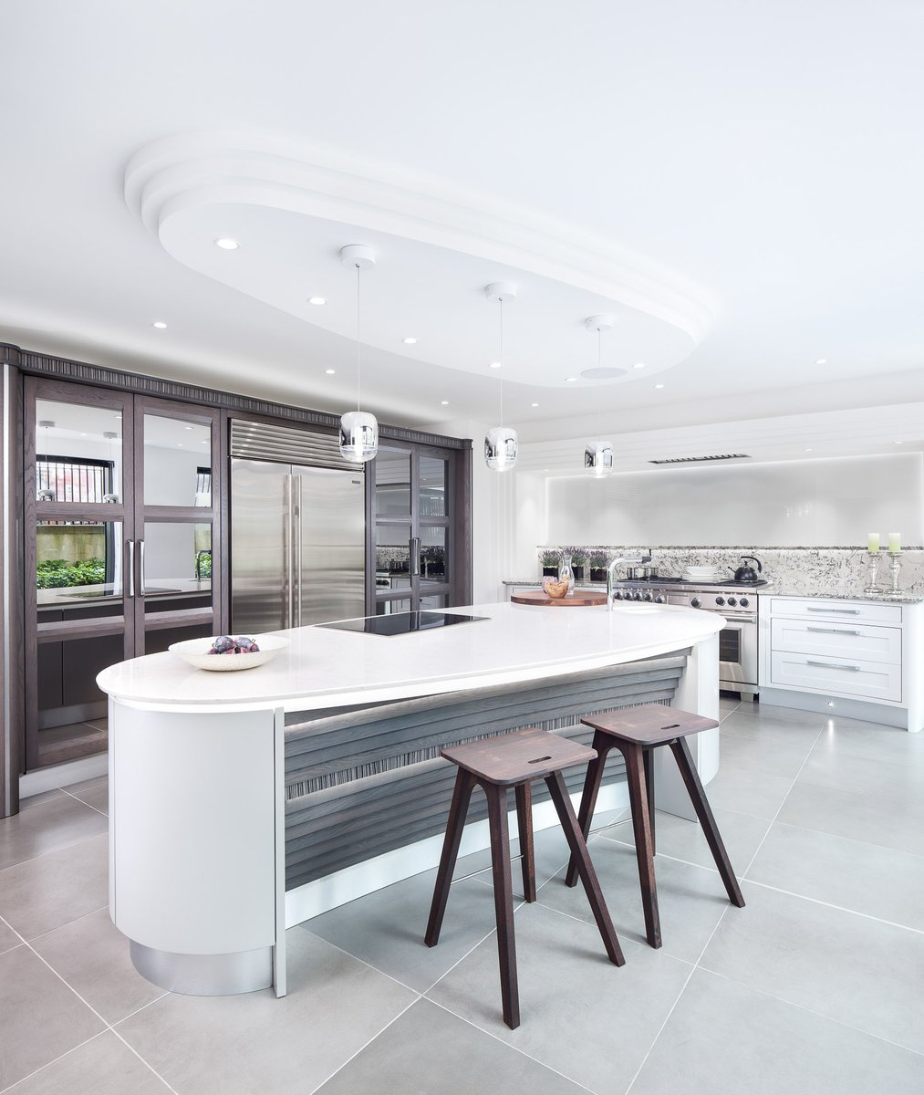 kitchensint's tweet photo. #kitchenofthemonth is @stonehamkitchen curved kitchen island with its @Silestone Lyra overhanging worktop, with a solid oak inlay chopping board. The contrasting grey of the Fusion units and the worktop give it a very stylish and chic look. https://t.co/XJpGxR0BnB