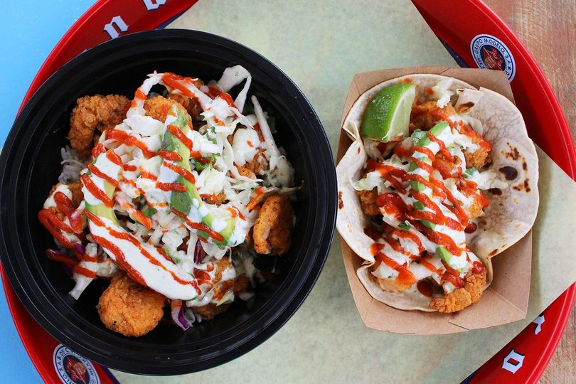 Our Dynamite Shrimp tastes even better than it looks! 🤤 It comes with fried shrimp, slaw, jalapeno ranch, avocado and sriracha. Order it as a taco or a street bowl today!