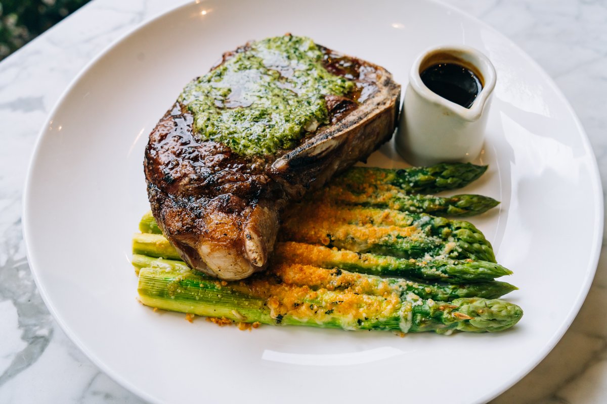 sckavalon's tweet photo. The Kansas City Strip Steak on South City Kitchen Avalon’s dinner menu is not to be missed! Served with asparagus au gratin, compound butter, chimichurri &amp; a side of signature red wine sauce 🤤 #SCKAvalon https://t.co/yzQ38Byrf2