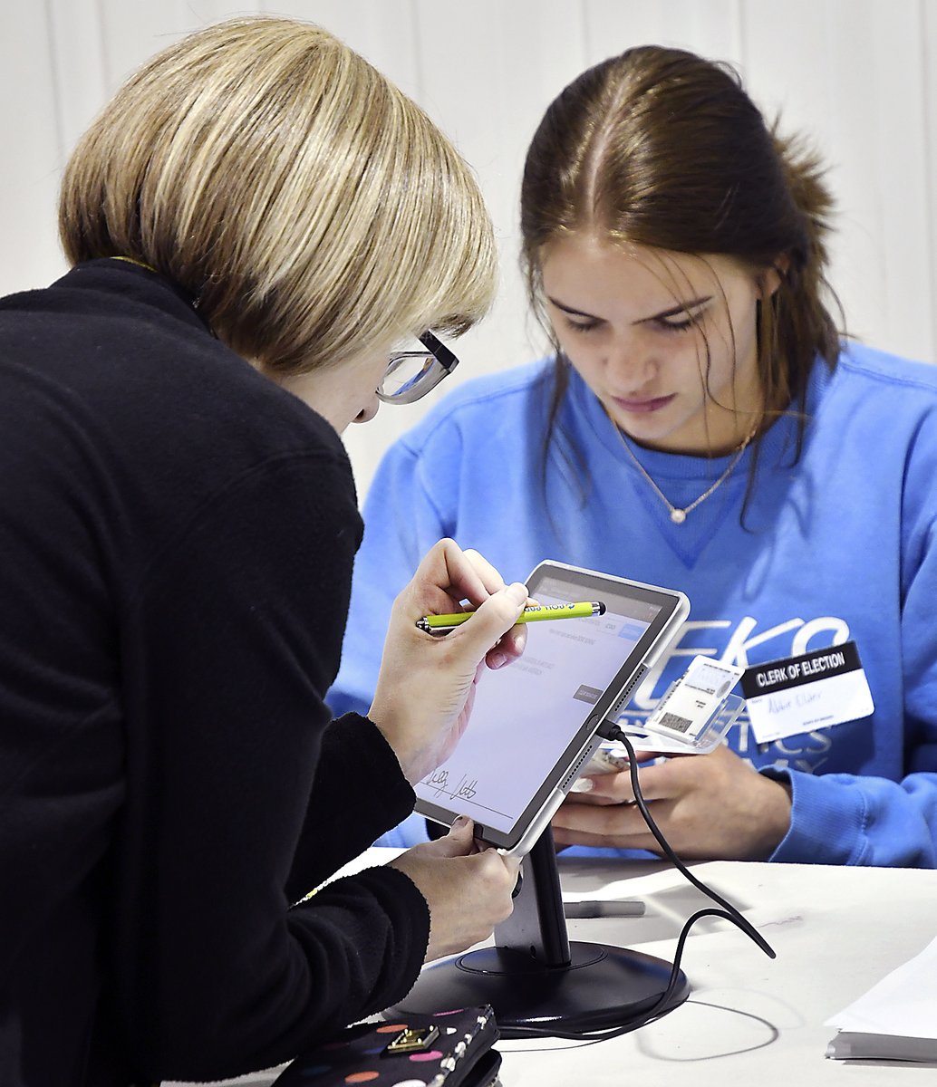 #MadCoVotes This voter uses the new electronic polling book system to sign before casting her vote at the Parkview Nazarene Church voting center. Poll workers say there has been no issues with the new system so far.