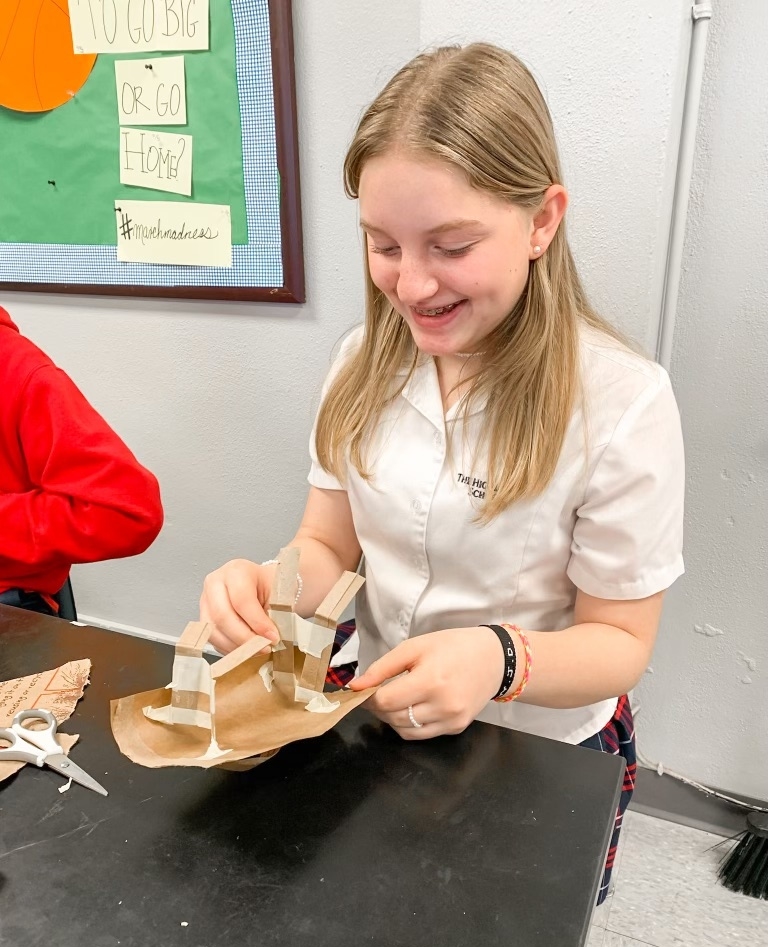 Based on Symbiotic Relationships: Using only a paper bag, create an animal that can stand upright and open its mouth.