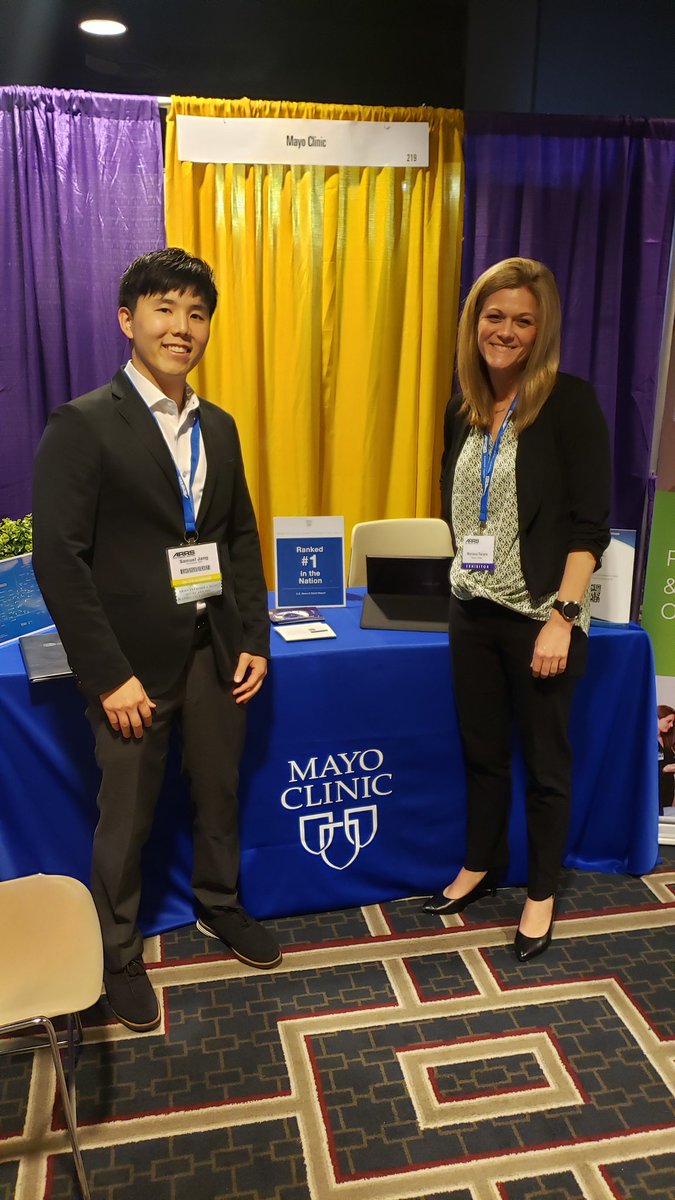 SamJangMD's tweet photo. Marissa recruiting hard for Mayo Clinic at a booth at #ARRS2022. All the swag bags are gone on Day 1. Did you know the Mayo Clinic logo is on the jersey of the Minnesota Lynx? @MayoRadiology https://t.co/DR98nJykbt