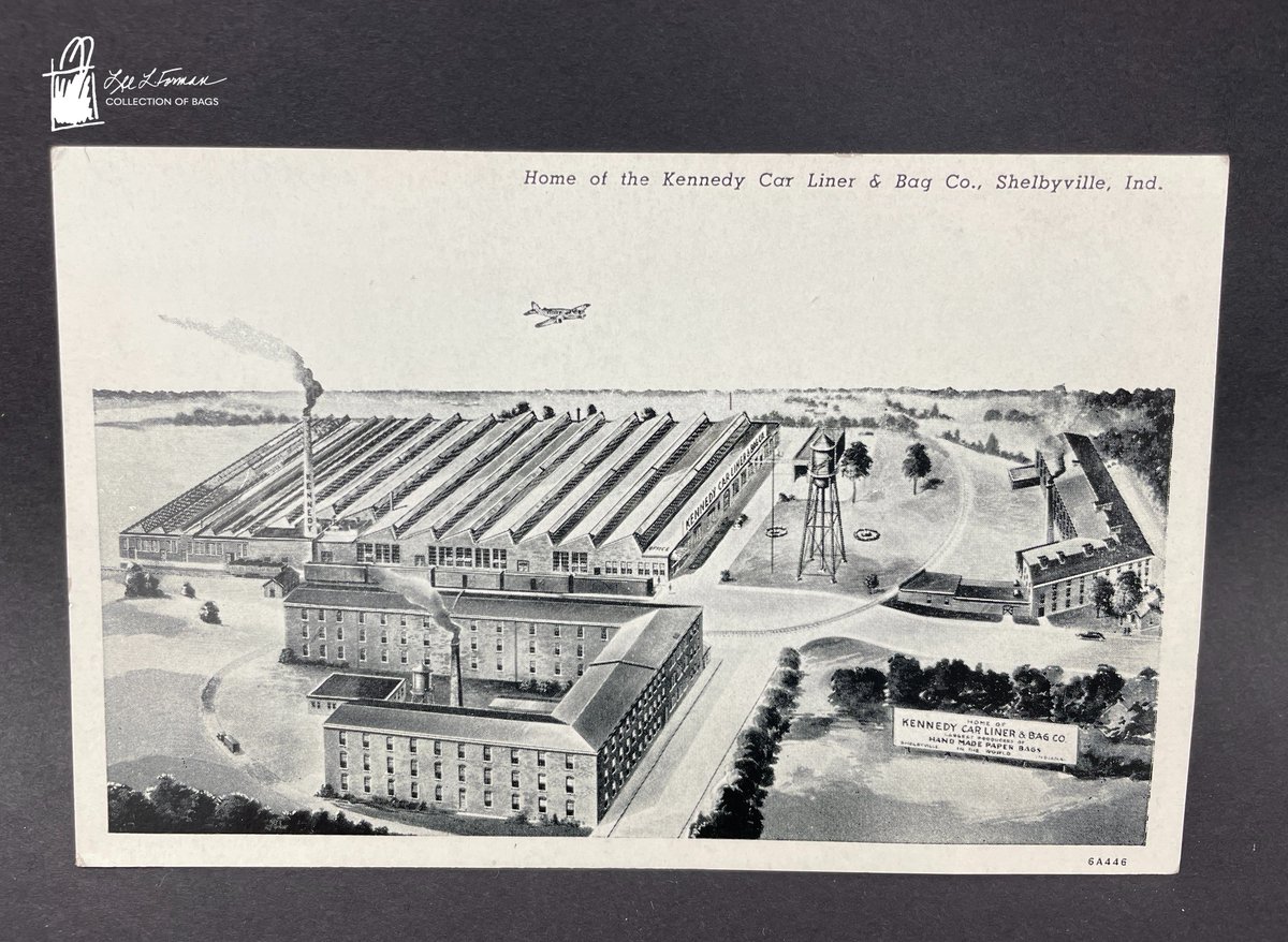 128/365: The Kennedy Car Liner & Bag Co. was founded by Fred W. Kennedy in Shelbyville, Indiana in 1912. A billboard within the image on this postcard proclaims it to be the 'largest producer of hand made paper bags in the world.'