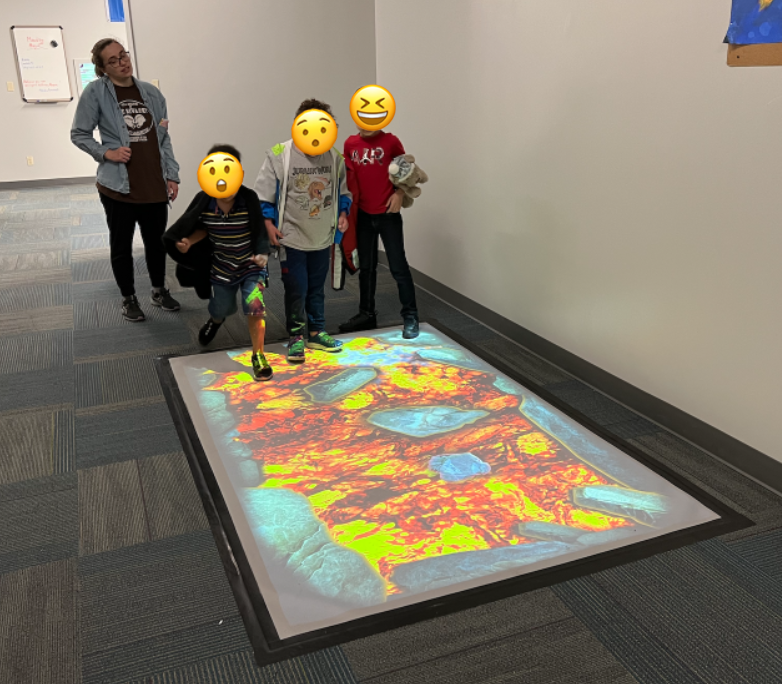 MissBoccella's tweet photo. Students in Room 17 are LOVING the new interactive hallway! We walked on lava, in a ball pit, and saw fish swim in a pond!🌋🐟 #centennial #interactivespace https://t.co/5HHbnboJ46