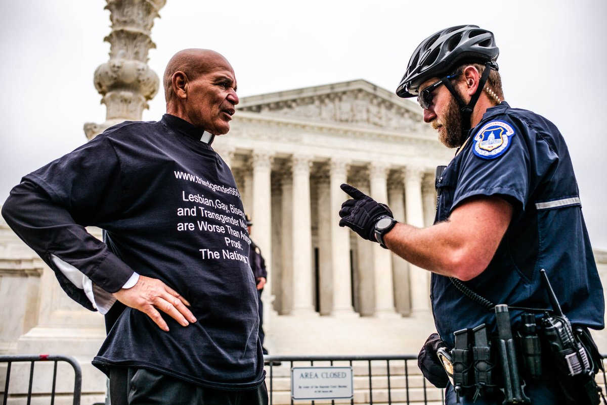 AaronAnf's tweet photo. Today at the Supreme Court: 'This Queer Pastor Loves You' debated godly love with a 'Worse than Animals' clergyman. 'Doctors not doctrine' in the background.#RoeVsWade #SupremeCourt #bansoffourbodies #roeoverturned https://t.co/A61H2i9o4Y