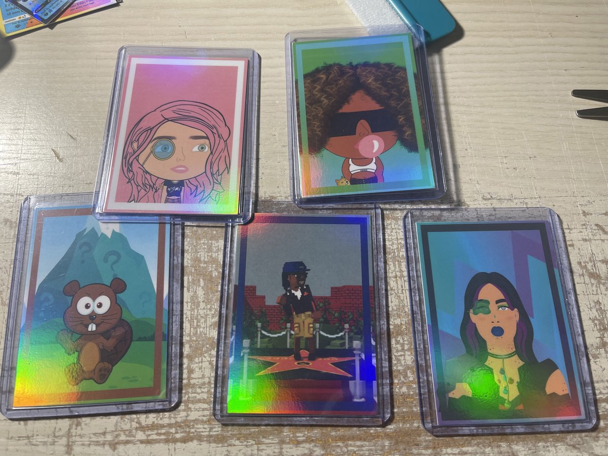 amalmariei's tweet photo. I'm such a dweeb, I had my fave #NFTs made into holographic trading cards – hoping to get them signed at #veecon // backs highlight traits and a QR code to @opensea // showing my #web2 too much? lol

@SnoopDogg @garyvee @veecon @worldofwomennft @FierceStudioNFT https://t.co/vc4M48VIIn