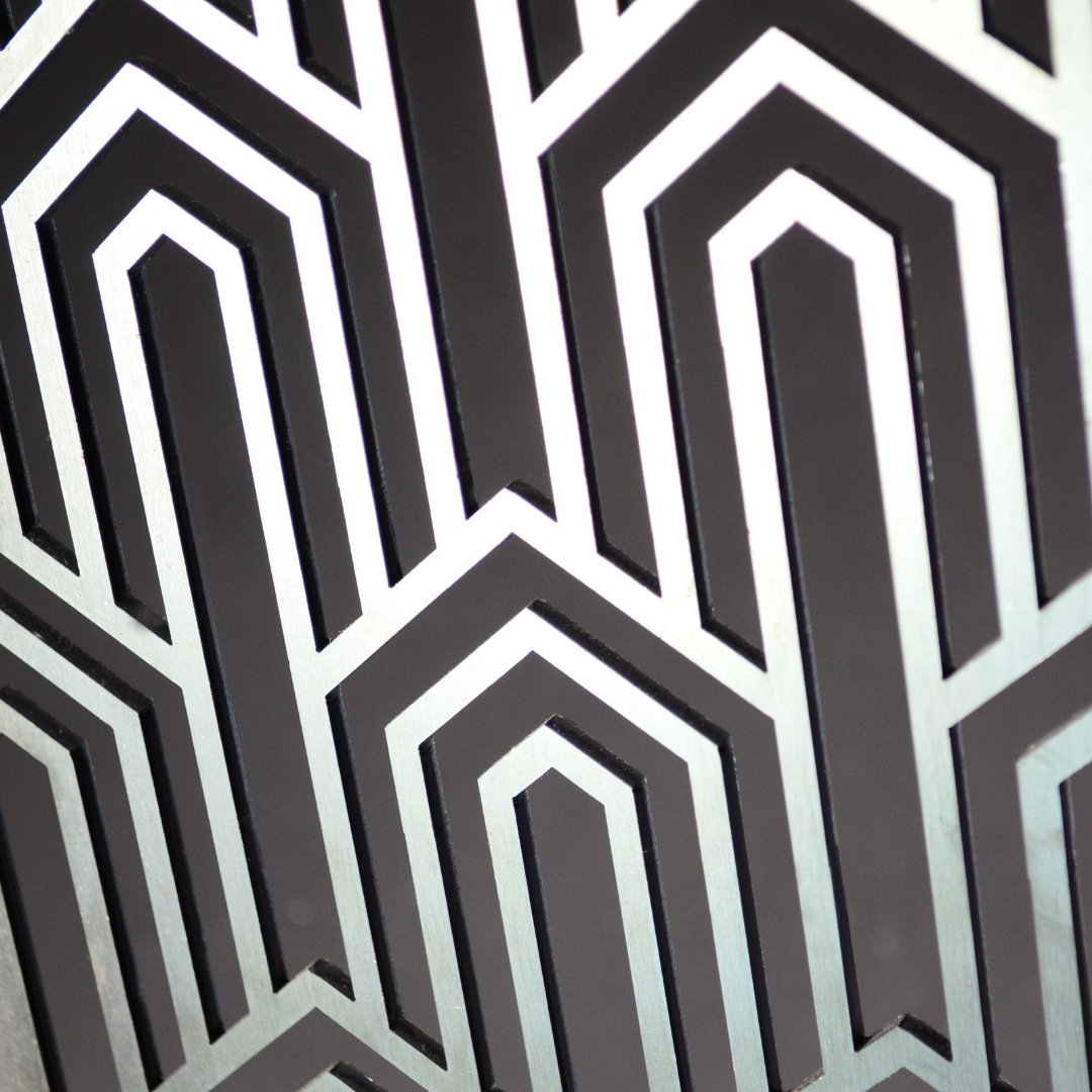 An Arty shot of our laser cut pattern in stainless steel. We love this 1920 Art Deco inspired design which is know for its precise, clear lines and geometric shapes and decoration. 
#Artdeco #metaldesign #lasercutting #geometricshapes #lasercutpattern #Graepels