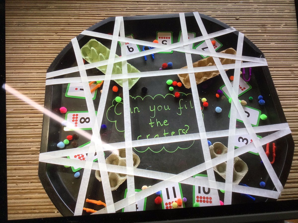 #reception counting pom-poms using tweezers and developing their motor skills.