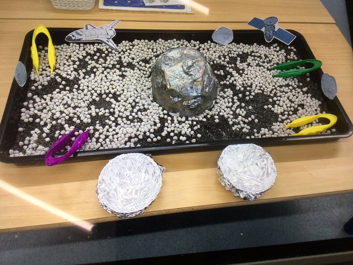 #preschool our topic is space. Our sensory tray is space using their fine motor skills to pick up the stars.