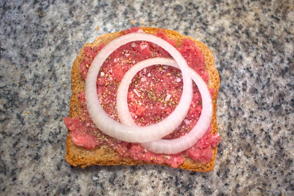 The cannibal sandwich (Wisconsin)—raw beef with onions on rye. Every year the health department begs people not to eat these