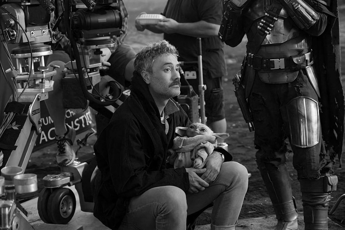 director taika waititi holding grogu on the set of the mandalorian