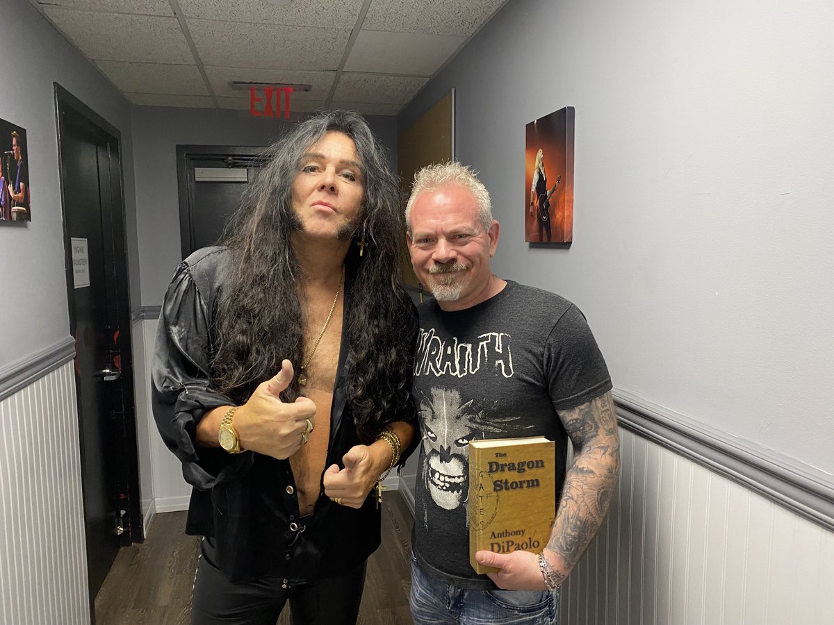 DragonStormBook's tweet photo. Hanging out with The Maestro himself, Yngwie J. Malmsteen, presenting him a personalized copy of The Dragon Storm - Gates. Already an avid fan, he was more than pleased to hear what an influence his music has had on me. Thank you for the inspiration and for a magnificent night! https://t.co/VbATsU4ySR