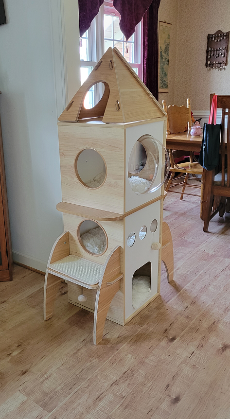 biliouris_amber's tweet photo. The Kitty Rocket Cat tower.  I assembled this with the help of our caregiver.  #CatsOnTwitter  #CatTower  #RocketTower https://t.co/IKtuY1ustl