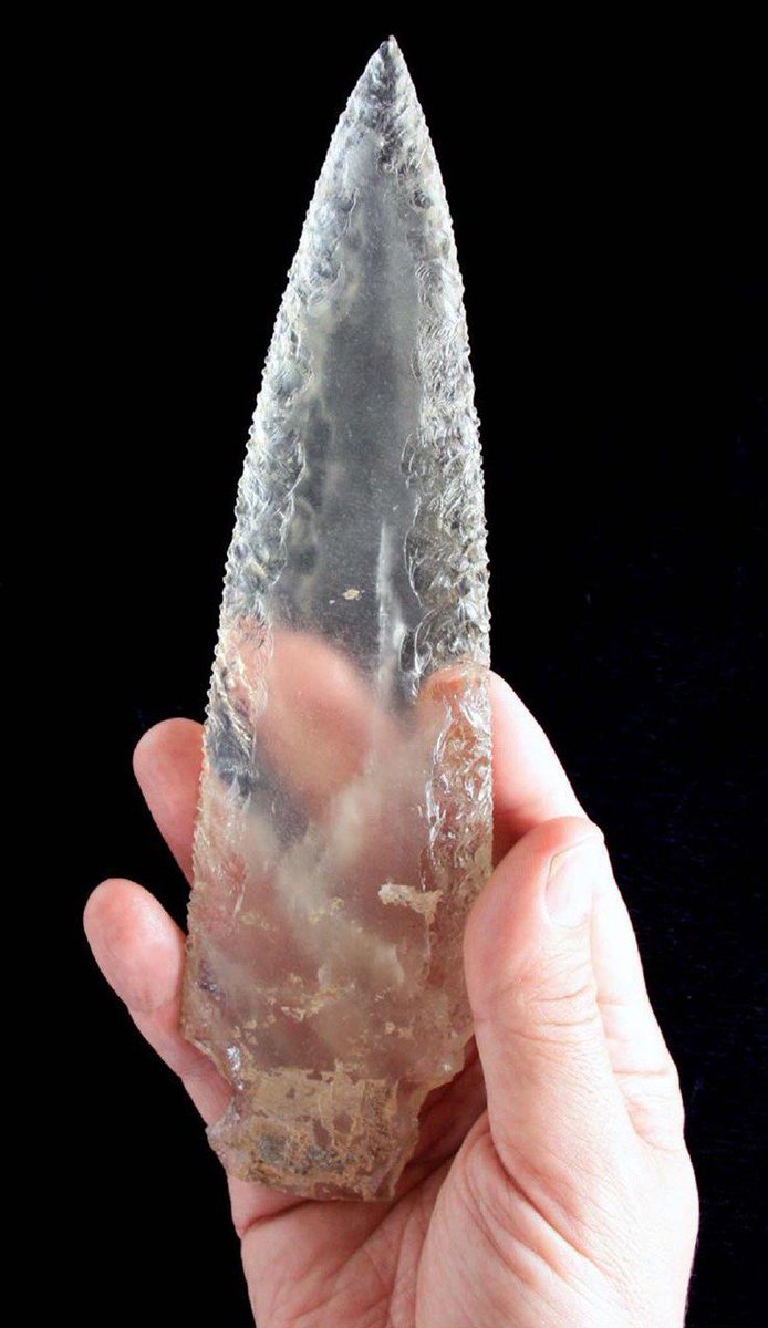 This exquisite c. 4,500 year old rock crystal dagger blade was discovered in a megalithic tomb, with two chambers, at Valencina de la Concepción, near Seville, in Spain. Additionally a large number of crystal arrowheads were found together.