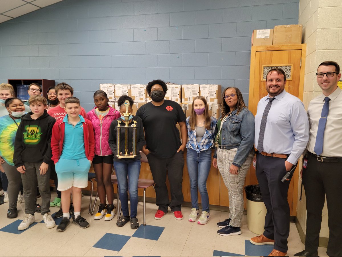 Thomas Clifton is the 7th grade math Pro-Bowl winner, he is celebrating with his admin team and  his students.