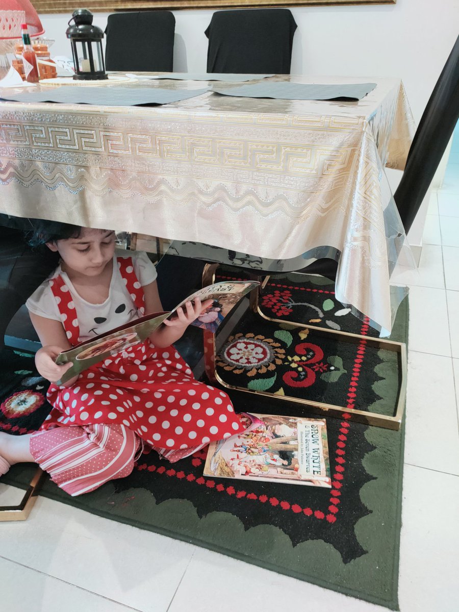 SaniyaBulbul's tweet photo. World Book Day 📚📖Today A Reader Tomorrow A Leader...Sofia Khan of KG 2C reading her favourite story book under the dining table😊 @Bushra_b05 @MichelleVerghe1 @Fatima_Martin @gemsnms_alkhail @NMSKindergarten https://t.co/zIYZn3qyM0
