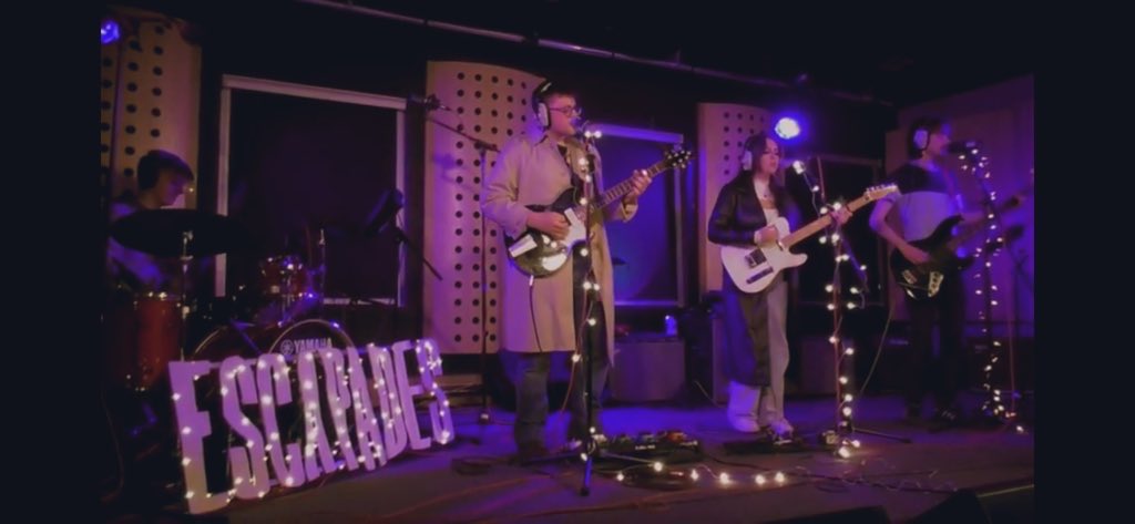 That stage set-up though 😍😍 it’s amazing what fairy lights and an <a href="/escapadesband/">Escapades</a> sign can do