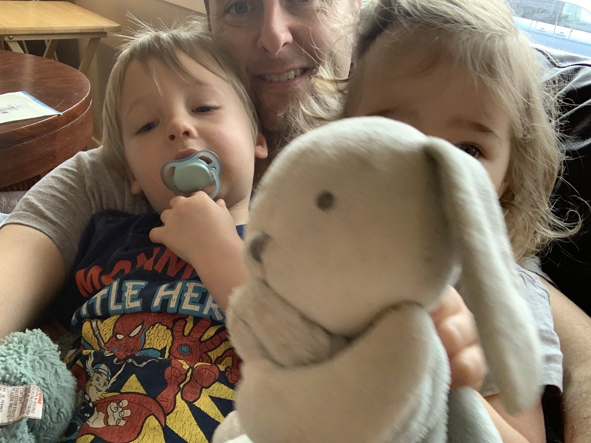 Rare moment all twins in the house are happy being with dad. #bunnyphotobomb