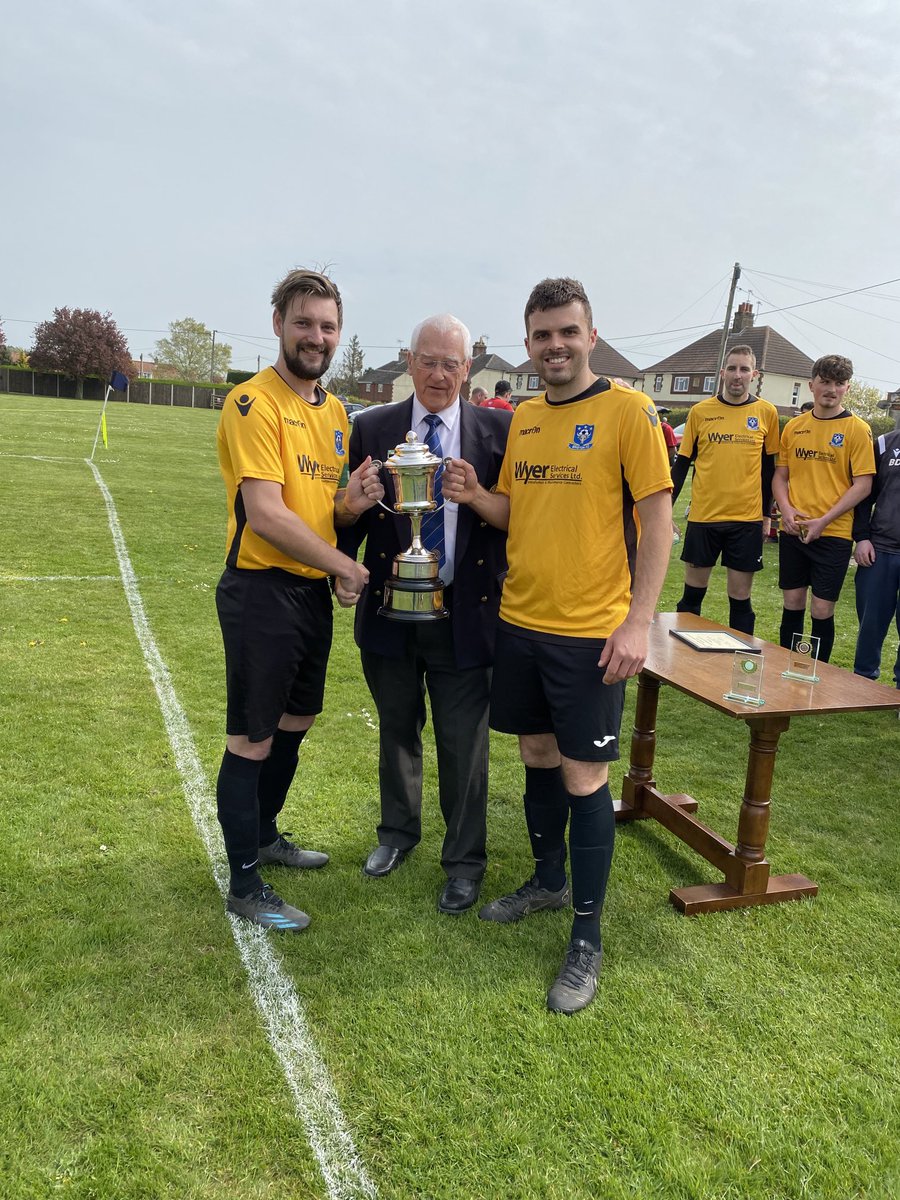 AcflSmith's tweet photo. Jack Smith presents Division 5(N) Championship Cup to Daniel Fuller captain and Luke Wilkinson, Vice Captain before their final match against Wells Res https://t.co/hLgYr1VugL