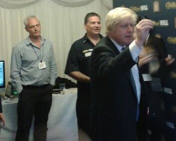 Oche180's tweet photo. Nadine Dorries delighted to see her boss throwing some javelins with Gary van Gerwen. 
#darts https://t.co/rnq21E5EU3