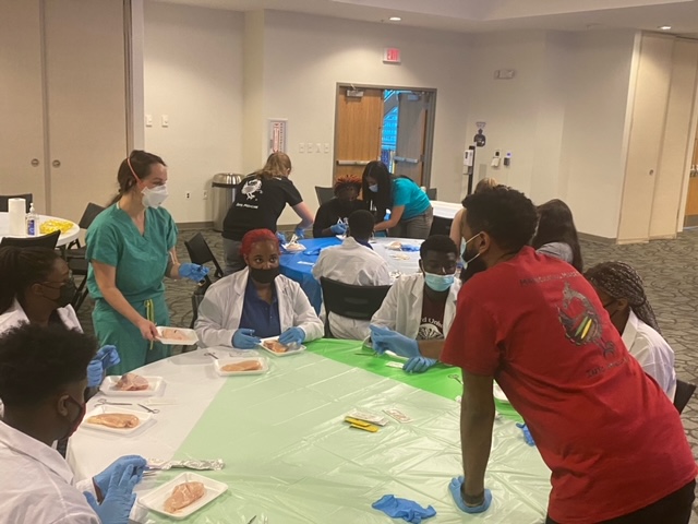 DUPreHealth's tweet photo. @du1869 @DUPreHealth @MAPS_DILLARD @DUAcademicAff @Dillard_UC DU is the host site for today's @cmmpmed Suturing Workshop, facilitated by local physicians! #myDU  #CMMPMed #DUFutureHealthProfessionals #MentorshipMatters #DiversifyingTheHealthProfessions 💊💉🩹👩🏽‍💻👩🏽‍⚕️👨🏽‍⚕️ https://t.co/lHNkySZJrv