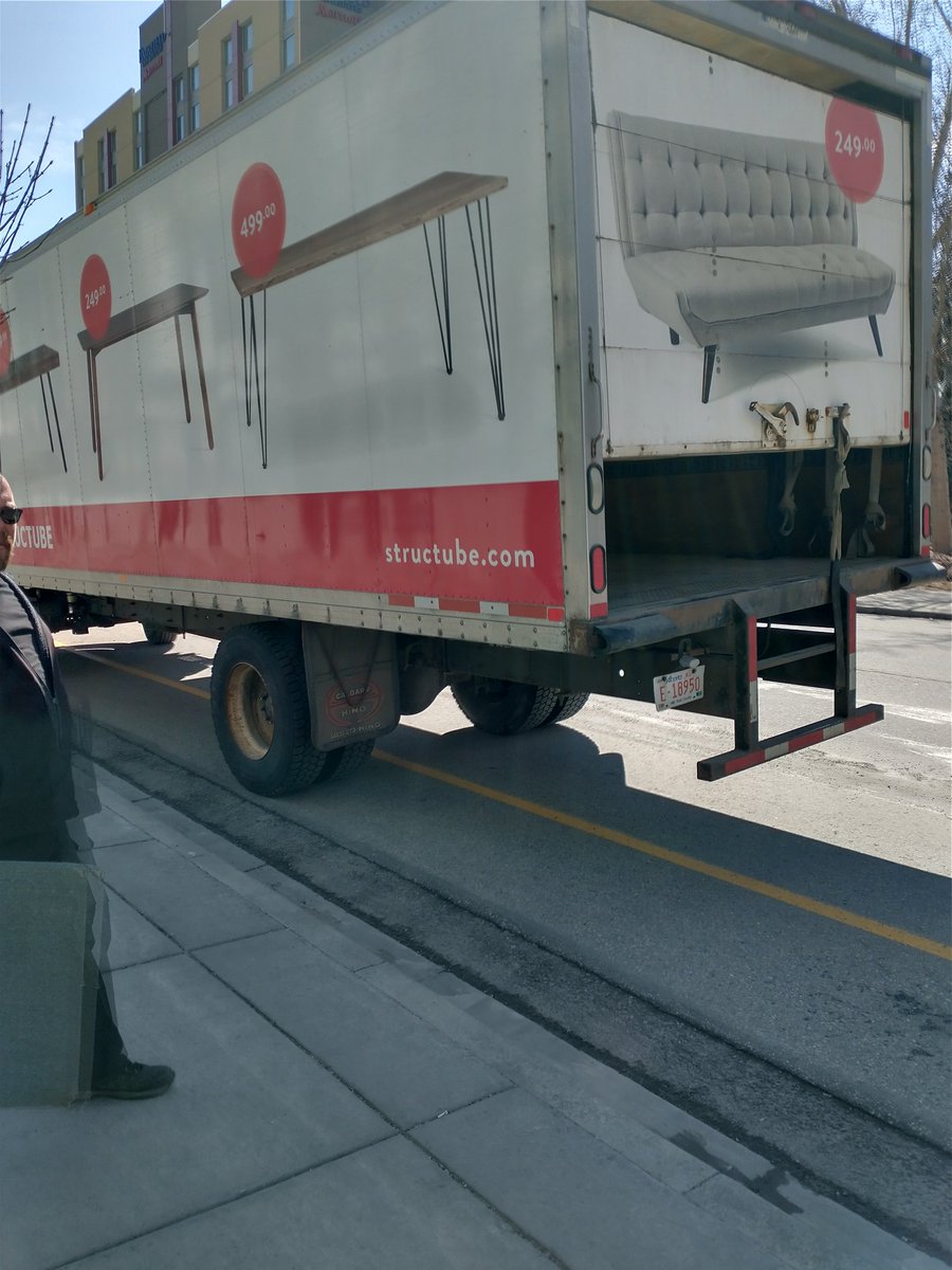 yycbikeguy's tweet photo. @structube you have some terrible delivery drivers. This building has a perfectly good loading dock, I'm not sure if your staff are untrained or just lazy. Completely blocking the lane and forcing #children on bikes into oncoming traffic #yyc #calgary #yycbike #structube https://t.co/kBAom40YoQ