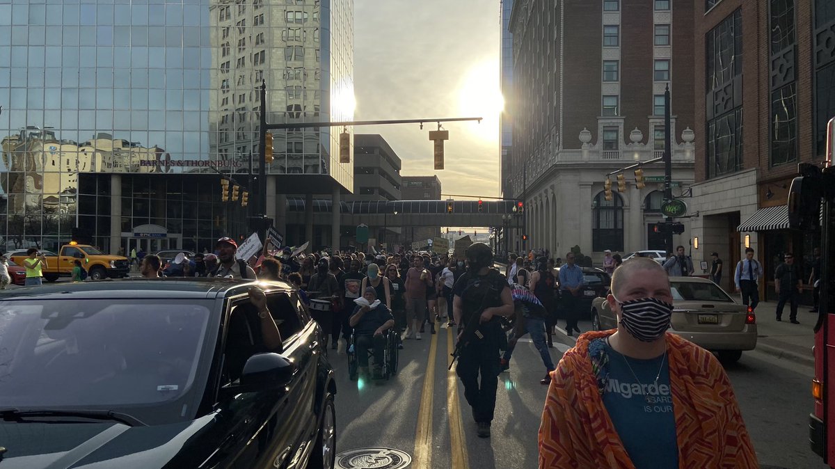 JustinBachman3's tweet photo. Protestors have taken to the streets, marching through downtown Grand Rapids. The momentarily filled the intersection of Pearl and Monroe, chanting and calling for the name of the officer who killed Patrick Lyoya to be released @wzzm13 https://t.co/q7msqFWtuz