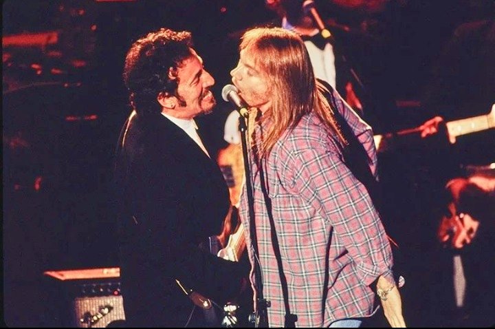 Axl Rose with Bruce Springsteen signing "Come Together" at the Rock &amp; Roll Hall of Fame, 1994.