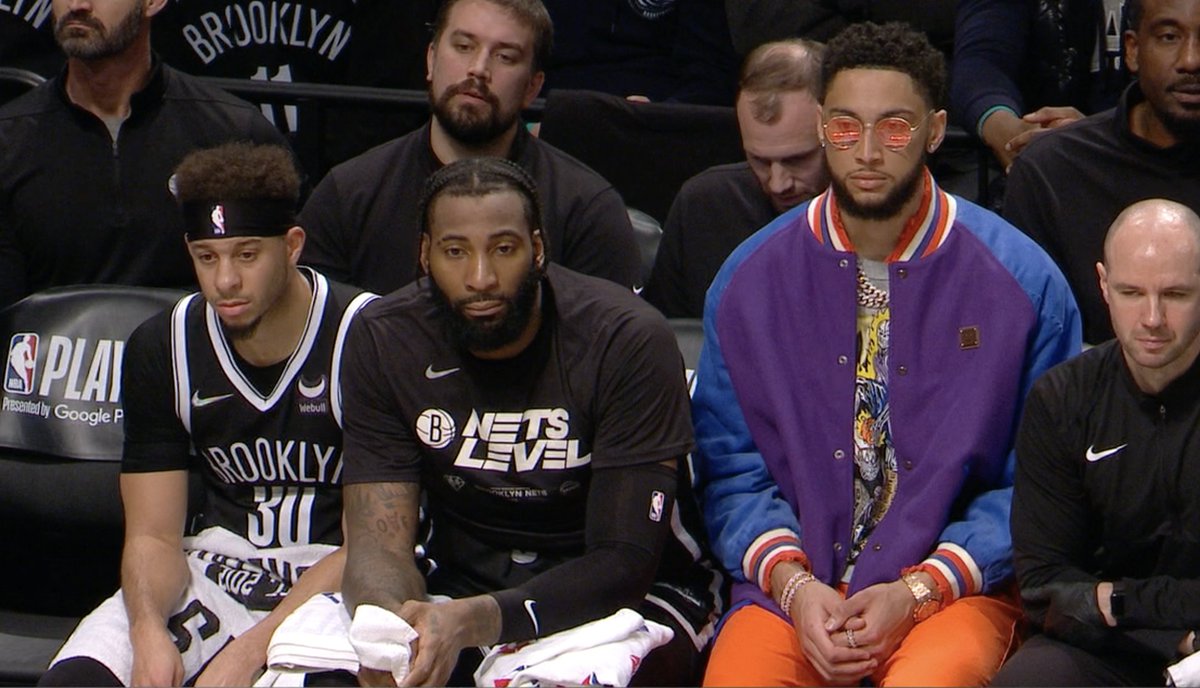 ESPNNBA's tweet photo. Ben Simmons' outfit really stands out on the Nets bench 😅 https://t.co/psIWvKvxWS