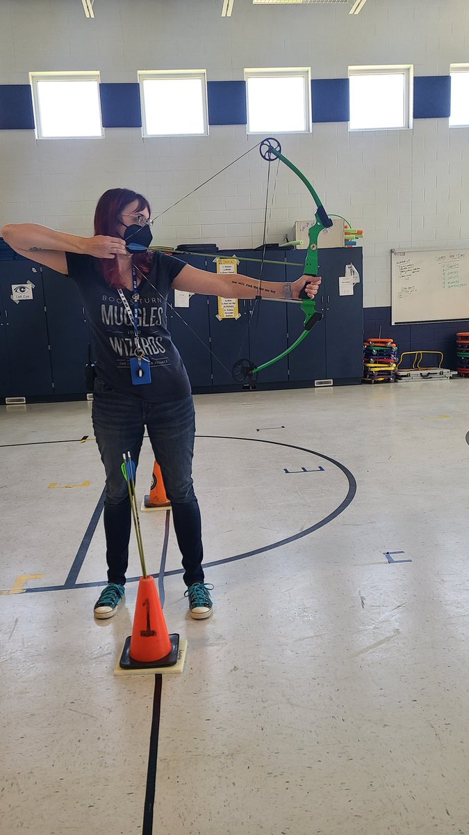 MsRosanne_reads's tweet photo. Who says staff meetings can't be exciting? Not THIS #encoreteam. Time for some Archery courtesy of @CoachPybus and @libmediabeach! @MrsSarmientoart did a great job and I had a few good attempts. Not bad since the last time I practiced was grade school. #BAESencore #teambuilding https://t.co/3JnCwEATnX