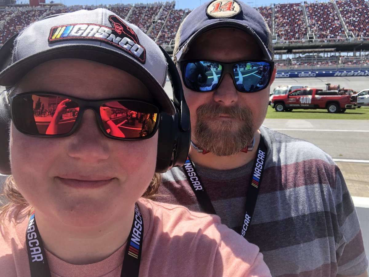 janewaldrop's tweet photo. Can’t go racing without repping my favorite podcast! ⁦@PodcastGas⁩ Y’all will forever be my favorites. 
(Photo featuring a rare appearance of my husband.) https://t.co/k24NkIkMVi