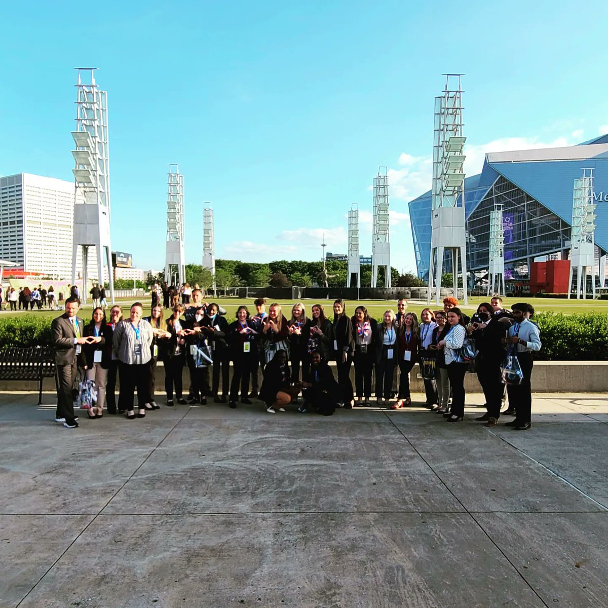 GallatinDECA's tweet photo. Day 2 of DECA ICDC
Six flags to opening session. 
Meeting new friends from multiple states (pictured with our new friends from Connecticut!), pin trading, Mercedes Benz stadium. Ready for first round of competition and day 3 tomorrow! #decaicdc #greenwavepride #decatn https://t.co/dufaO5Ybfx