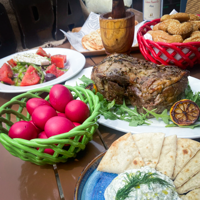 What could be better than a full table on Greek Easter? Join our big Greek family celebration today! Receive a free glass of house wine with any lamb entrée, and test your luck with #tsougrisma! #ChristosAnesti 🇬🇷