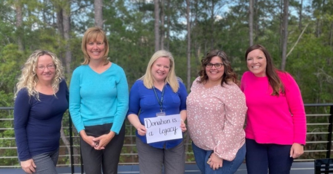 SharingHopeSC's tweet photo. "Donation is...a Legacy," SHSC Finance Department #ShareHope #DonateLife #NDLM #SCBlueGreen @DonateLife @UNOSNews https://t.co/uS9seib8dA