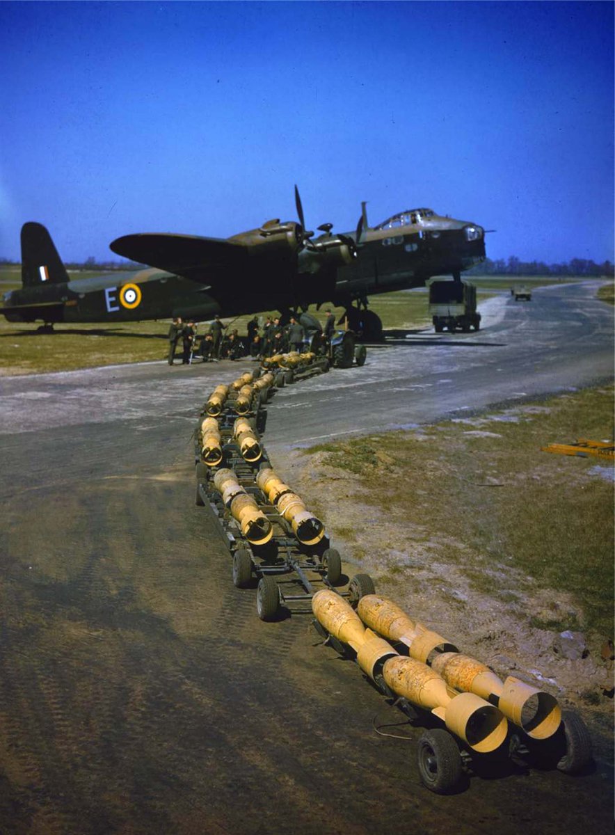 WW2Today's tweet image. April 1942

The early use of colour photography by the RAF. A bomb-train of sixteen 250lb bombs arriving to be loaded by the waiting Royal Air Force armourers into Short Stirling bomber N6101 of No 1651 Heavy Conversion Unit at Waterbeach, Cambridgeshire.

#otd #history #ww2 #war