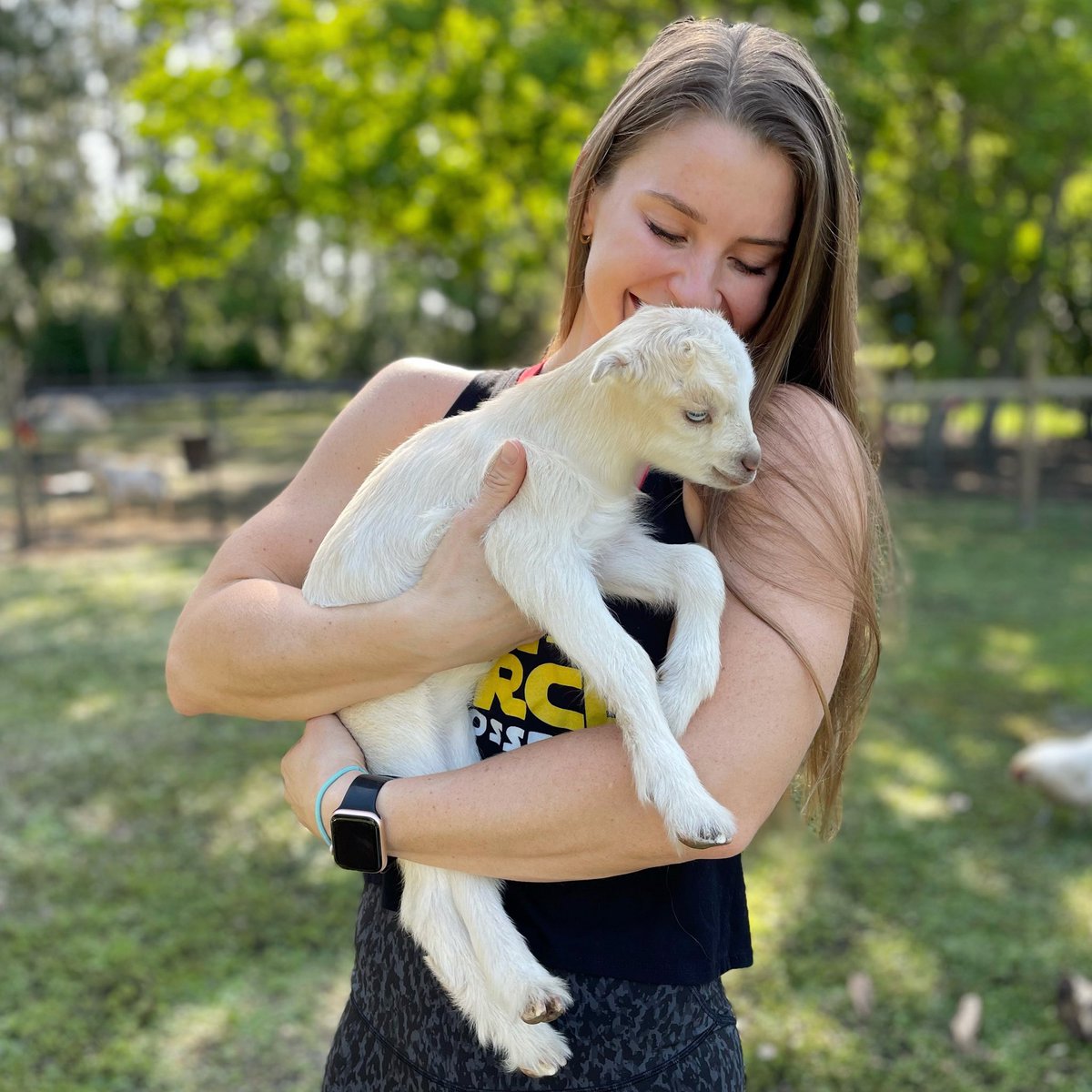 The feminine urge to snuggle baby goats