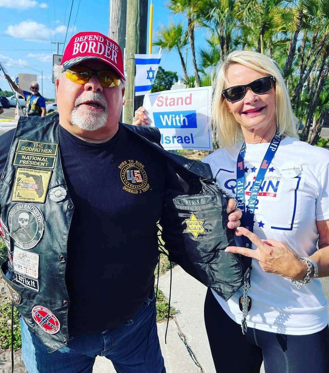 Florida Republican House candidate Christine Quinn showing off a “never again” Star of David patch worn by a guy who is also wearing a Confederate flag patch.