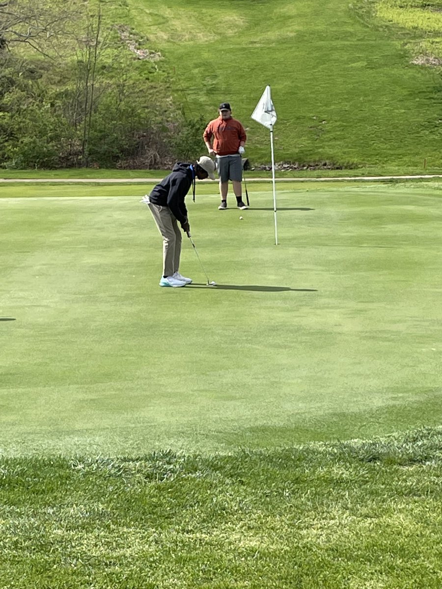 Sophomore Mark Tate stands over his birdie putt on the Par 3 7th hole