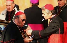 The mafia works closely with the Vatican. The owners of the mafia are the Black Nobility which also own the Vatican. The mafia pay much of their tributes or taxes to the Black Nobility through the Vatican and its charitable rackets and the priests keep track of these tributes.
