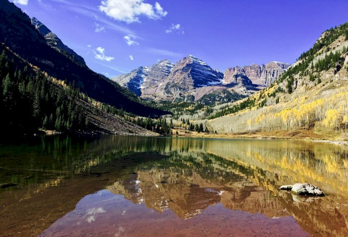 This is Maroon Bells, Colorado. It's part of the Rocky Mountains and full of beautiful hiking trails. Share with us your favorite place to go hiking.