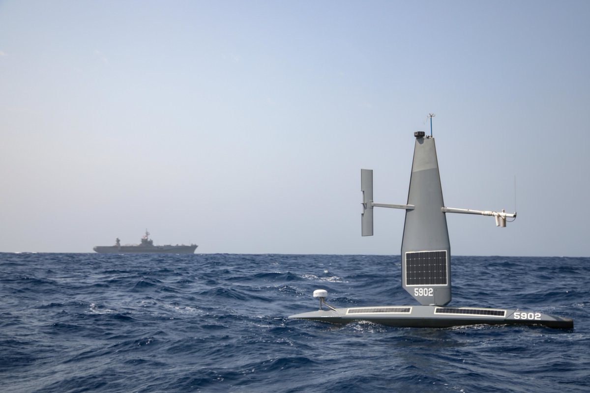 USNavy's tweet photo. Taking the robot out for a spin. 🤖
A Saildrone Explorer unmanned surface vessel and the #EgyptianNavy frigate ENS Alexandria (F911) operate in the Red Sea in support of the newly established Combined Task Force 153. https://t.co/TrXdQHrGvg