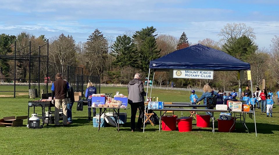 The Mount Kisco NY Rotary Club in District 7230 cooking hundreds of burgers and franks Saturday at the Leonard Park baseball diamonds.  Mount Kisco Rotary also buys the food and donates all the cash collected to help fund the Mount Kisco Little League.