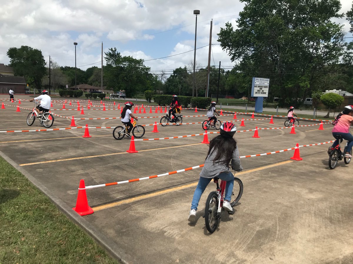 hcpct1's tweet photo. Precinct One assisted Harris County Public Health and Safe Routes Acres Homes with a bike safety course for the students at Houston STARS Academy on Saturday. #RideONE https://t.co/0zkmWXSMej