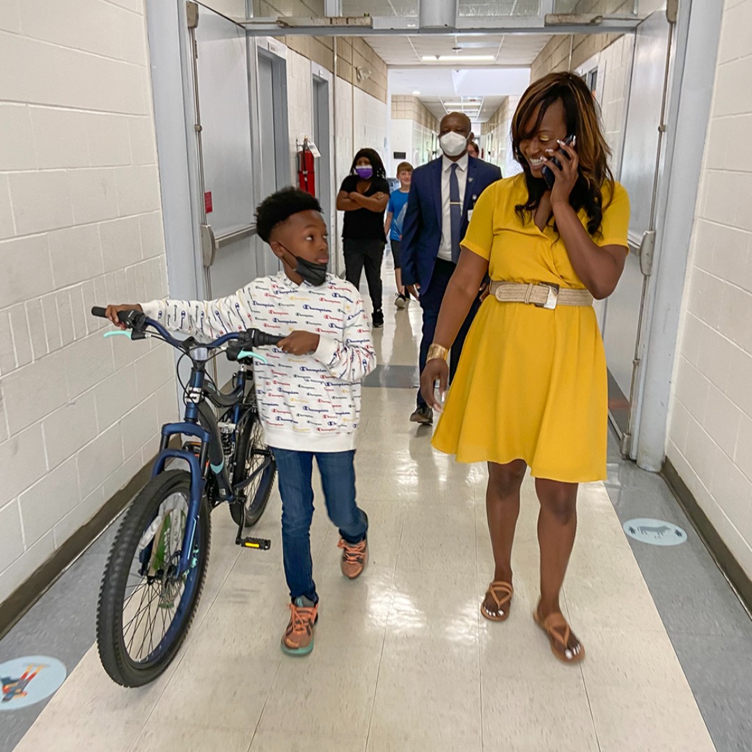 DurhamPublicSch's tweet photo. DPS spelling bee champ Frank Dumas received quite the surprise this morning when Dr. Pascal Mubenga, Superintendent, showed up at Bethesda Elementary to present him with a bike for his hard work! Frank will participate in the national Scripps spelling bee on June 2. https://t.co/xkVjUqvJ9D