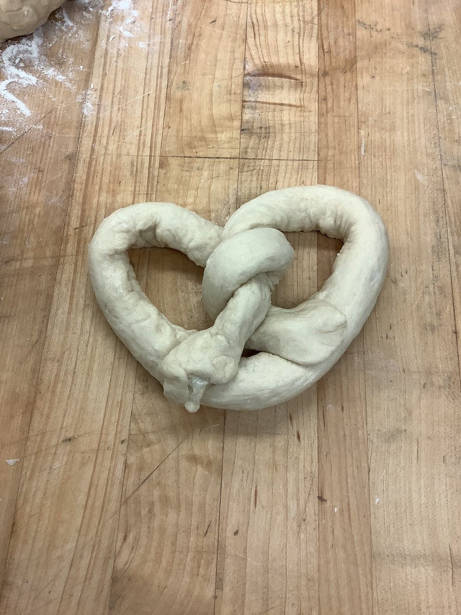 WesternAreaCTC's tweet photo. It’s National 🥨 Day!  Check out our pretzel assembly line in Culinary Arts!  To truly test our students skills we challenged them to make mascarpone filled pretzels and they turned out delicious!  Well done everyone 👍🇮🇹🇩🇪 #NationalPretzelDay https://t.co/Q26yVcKYgP
