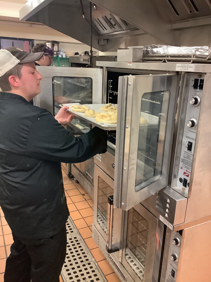 WesternAreaCTC's tweet photo. It’s National 🥨 Day!  Check out our pretzel assembly line in Culinary Arts!  To truly test our students skills we challenged them to make mascarpone filled pretzels and they turned out delicious!  Well done everyone 👍🇮🇹🇩🇪 #NationalPretzelDay https://t.co/Q26yVcKYgP